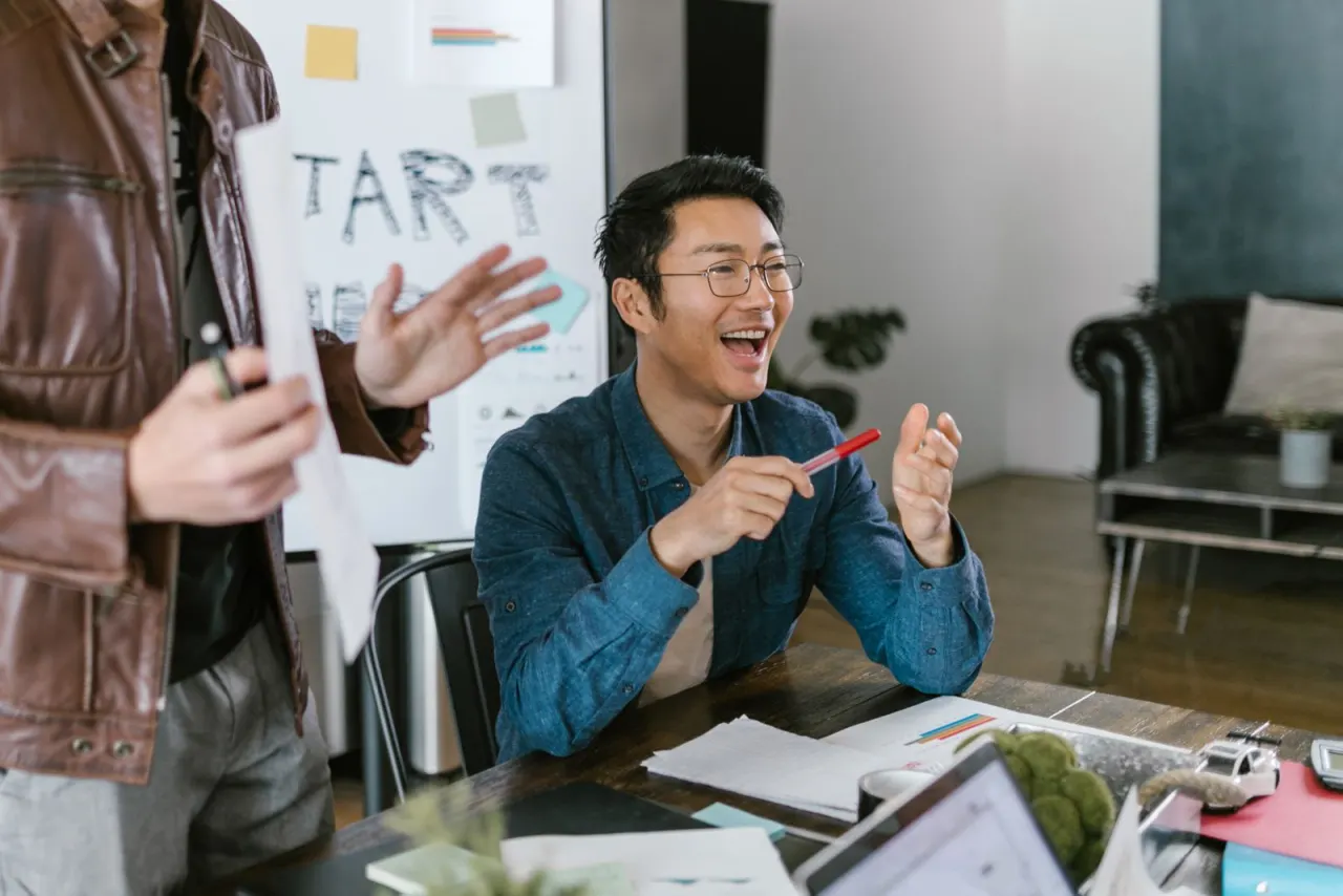 A marketing team collaborating around a campaign plan